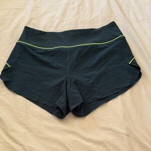 Athleta Dark Green Run With It Shorts with Lime Accents
